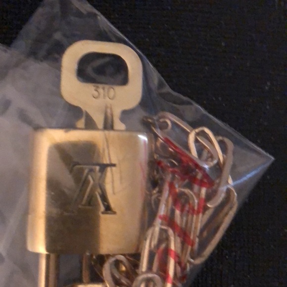 Louis Vuitton Lock & key # 310. Comes on 16” necklace. Looks NEW! - Picture 2 of 5